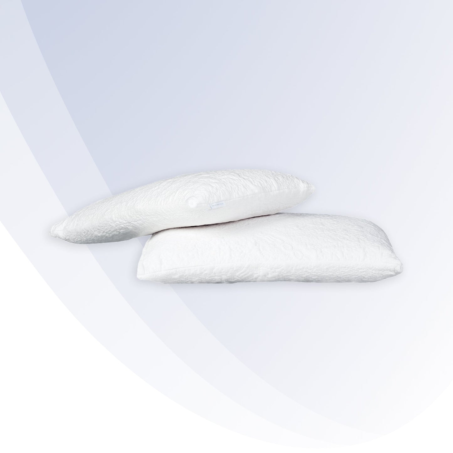 "Two white pillows on a light gray background"